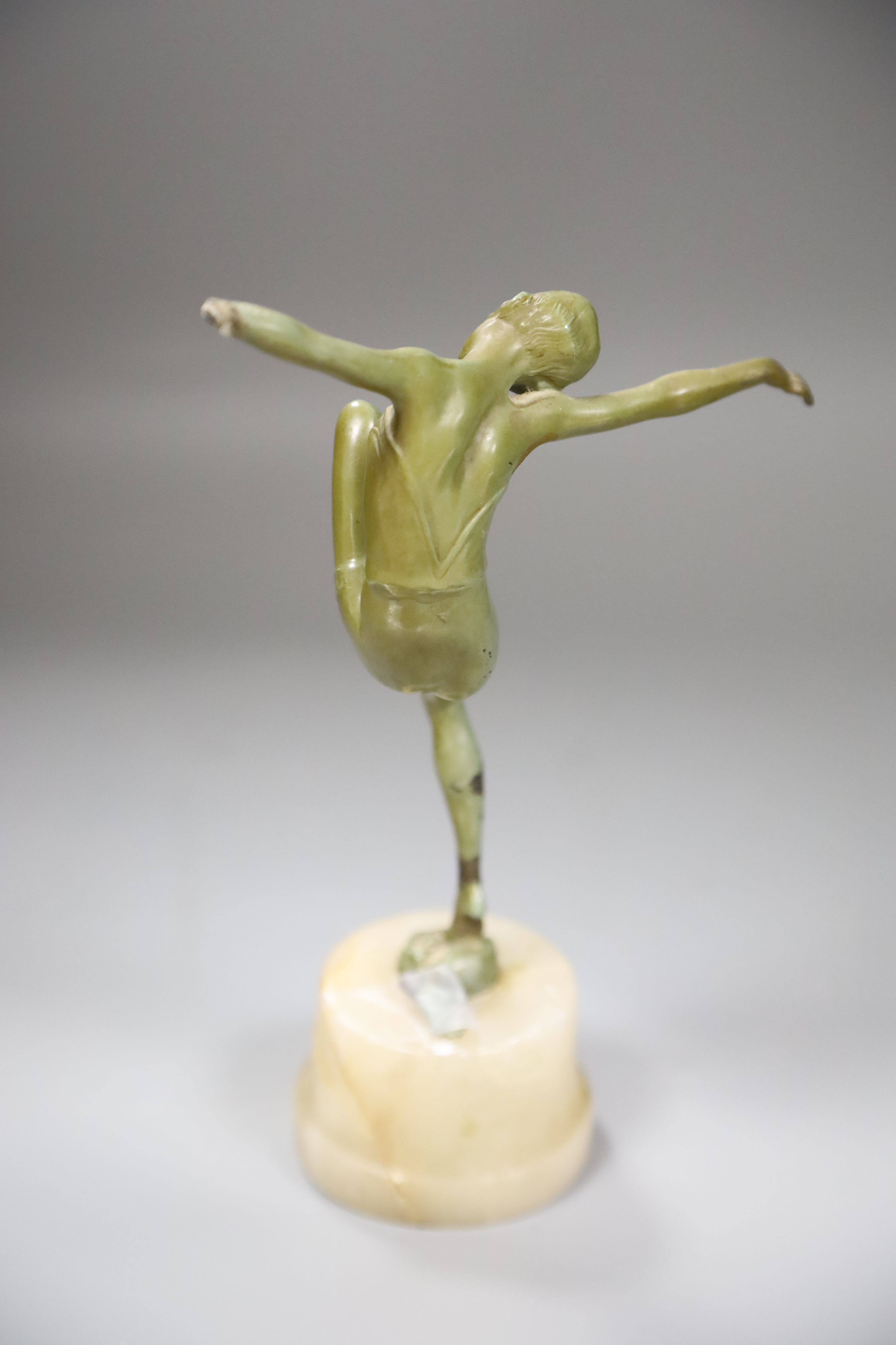 An Art Deco bronzed spelter model of a dancer, on an onyx plinth, height 25cm (a.f.)